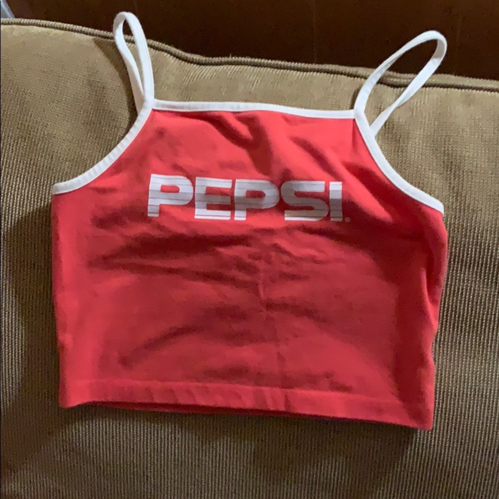 I’m selling a coral crop top that says Pepsi